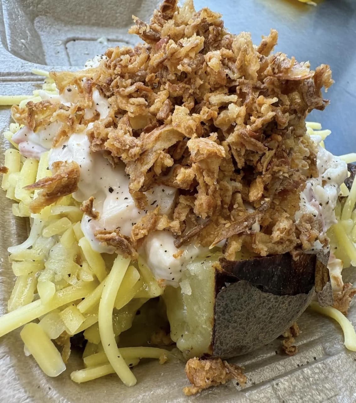 Jacket potato with cheese and crispy onions